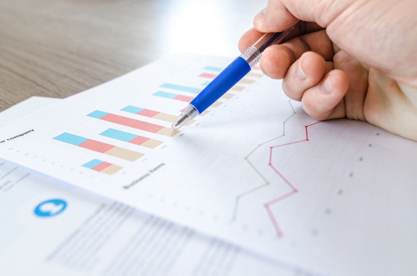 Underwriter reviewing case portfolio data and charts